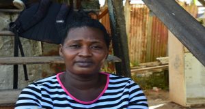 Mother of the deceased Nicola Simon speaking with the Guyana Chronicle a short distance away from where her son was gunned down