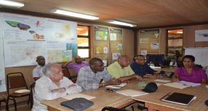 From Left: Sir Shridath Ramphal; Minister of Public Infrastructure, David Patterson; Minister of Governance, Raphael Trotman; and Ministerial Advisor to Minister Patterson, Kenneth Jordan; paying attention to the presentation which was made on the company's operations 