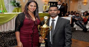 Second Division Player of the Year Jeetenda Harilall collects his prize from Renata Singh, daughter of OMSCC president Jai Singh 