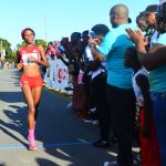 Trinidad and Tobago’s Tonya Nero is all alone as she crosses the finish line in the National Park yesterday. (Photo (Samuel Maughn photos).