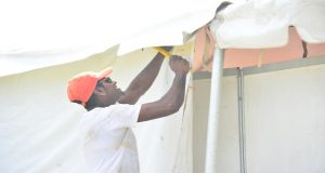 A worker getting one of the tents in order for the exhibition