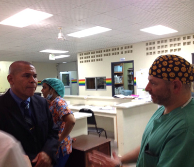 A member of the team in discussion with Dr Norton
