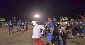 Spectators rushed the playing area to congratulate Gregory Richardson after scoring the equaliser for Sparta Boss. 