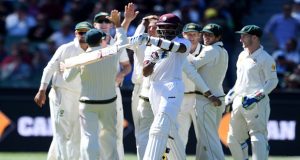 There are high fives flying all over the place for Australia as they press home their advantage at the MCG. Photograph: Tracey Nearmy/AAP