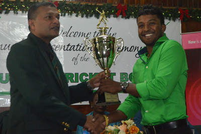 Veerasammy Permaul collects his trophy from GCB Secretary and WICB Director Anand Sanasie (Cullen Nelson Photo)