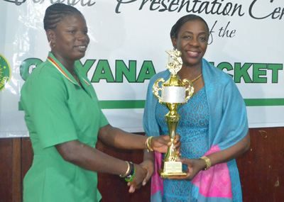Tremayne Smart collects her trophy from Minister within the Education Ministry Nicolette Henry (Cullen Nelson Photo)