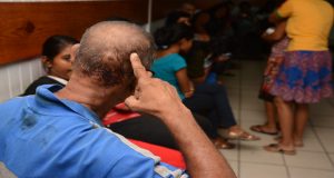 Pastor Rohit Deonarine shows the Guyana Chronicle the injury he received to his head