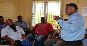 Special Assistant to the Prime Minister, Harrinarine Deokenanan, interacts with the private cane farmers at yesterday’s meeting 