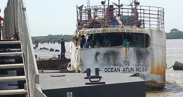 The scene at the Demerara Harbour Bridge minutes after the accident occurred at Span 13. At right is the vessel, the Ocean ATUN No. 66, which ran into it