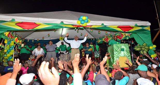 A jubilant President David Granger and his APNU-AFC entourage take to their feet at the end of last night’s meeting in Linden [Photo by Adrian Narine)