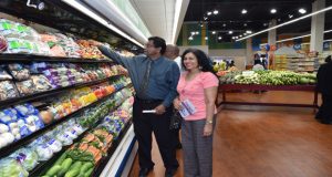 Minister Khemraj Ramjattan and his lovely wife checking out the fresh produce in the supermarket yesterday. 