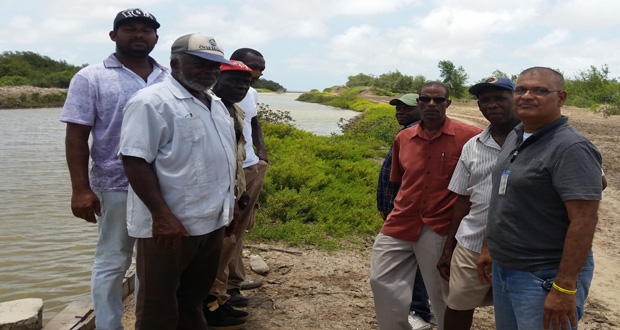 Harbhajan [extreme right) with residents during a site visit at one of the blocked channels yesterday