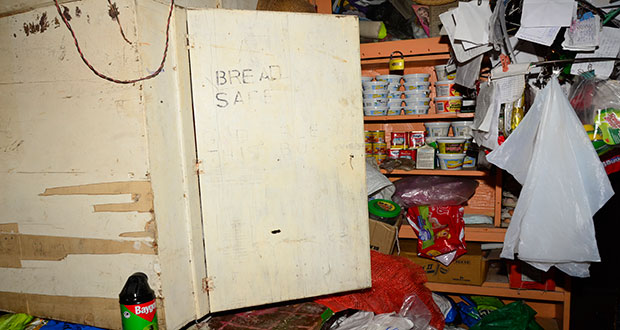 The scene inside the shopkeeper’s home after the bandit was shot and killed