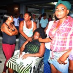 Taylor’s wife, Michelle, being comforted by relatives at the Georgetown Public Hospital 