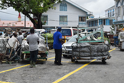 City Council workers with the belongings of stallholders at City Hall [Cullen Bess-Nelson photo)