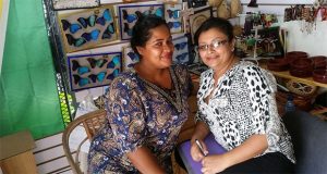 Ms. Debbie George [left) and Ms. Saudia Ali, business partners at 'Crafty Creations', have enjoyed the increase in sales brought about by the large number of visitors 