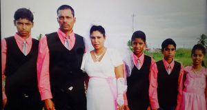  The Chandradeo family is seen in this July 5, 2016 photo when Mr and Mrs Pawan Chandradeo renewed their marriage vows. Mr Chandradeo and his son Kevin, left, along with Mrs Chandradeo’s brother, were shot dead on Thursday night. Alvin, fourth from right, had also gone on a fishing trip to the backdam, but was told to wait at the security post at the koker while the others went for the catch of hassar 