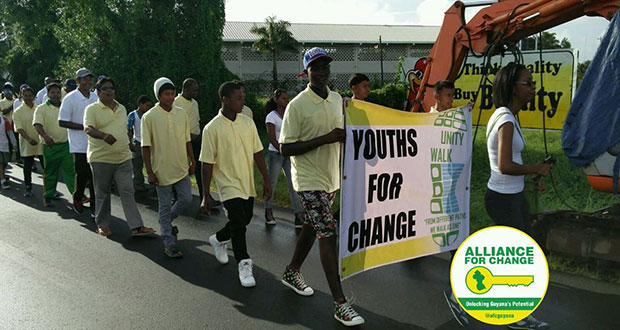 Youths marching along the street yesterday [compliments of the Alliance For Change Facebook page)