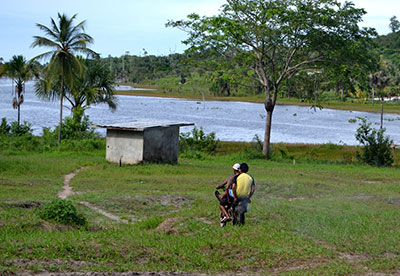 Three men on a motorcycle attracted the attention of the spectators who were watching the cricket match at the time.