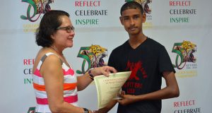 First Lady Sandra Granger presents Sunil Latchman with his certificate of achievement at the conclusion of the workshop 