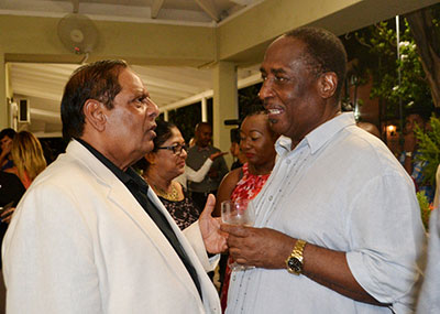 Wages talks: Prime Minister Moses Nagamootoo engages President of the Guyana Public Service Union (GPSU) during Monday evening’s reception at the residence of the Canadian High Commission 