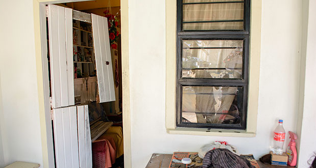 The wooden door which was kicked down by the bandits.