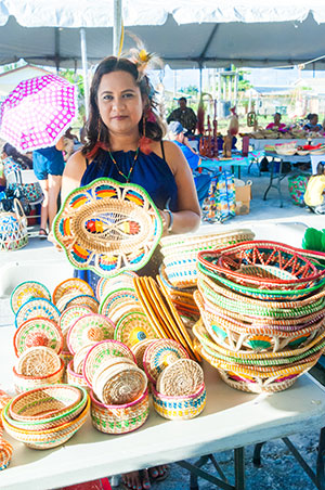 Miranda Bernard showcases the hats she made for this year’s exhibition