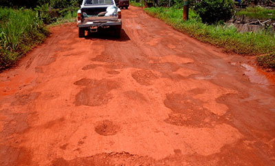 A vehicle moves along the roadway in the Mabaruma sub-region last weekend. The roadways in the area have been in a dire state in recent months and residents have been calling on the authorities to fix them