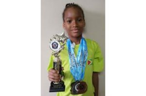 Aleka Persaud displays just a few of her many medals and trophies