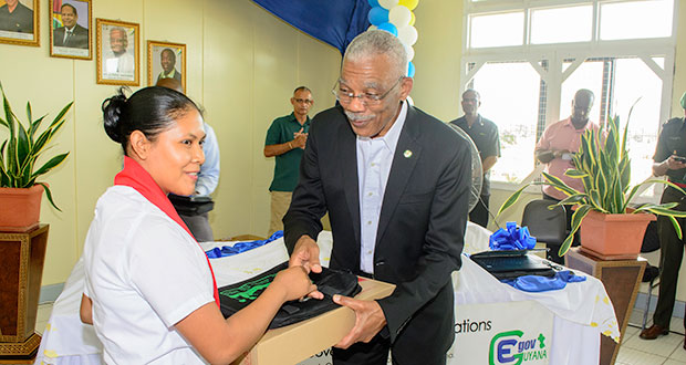 A trainee teacher of the Cyril Potter College of Education was presented with a laptop on Wednesday by President David Granger as part of Government’s roll-out of its One Laptop Per Teacher Initiative