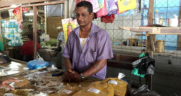 Guyanese-born vendor Ragoemani Munnsami at his stall last Saturday