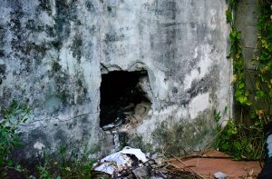 The hole which is believed to have been the point of entry for the person(s) who is/are believed to have set the Cummings Street building on fire) 