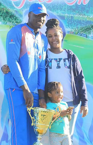 Rondell Montfort with wife and daughter