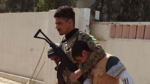 Kurdish fighters could be seen with detainees in Kirkuk on Saturday