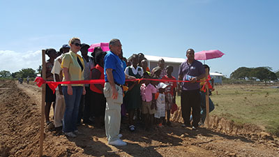 ‘Uncle Joe’ helping with the ceremonial cutting of the ribbon on Tuesday to declare the community open 