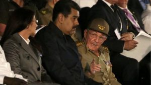 Venezuelan President Nicolas Maduro, centre, joined Cuban President Raul Castro for the rally