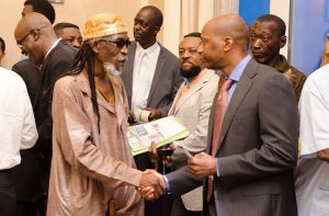  Ras Leon Saul of the Rastafarian community greets Asafa Selwin George of ACDA, prior to the launch of the African Business Roundtable
