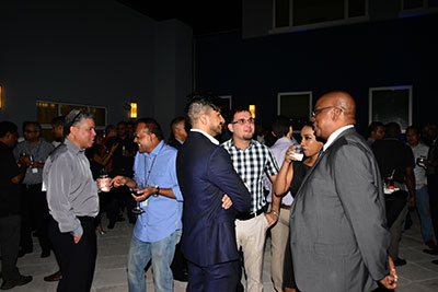 Finance Minister Winston Jordan (at right) interacts with Republic Bank officials during a cocktail reception on Monday evening at the Pegasus Hotel