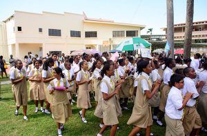 Students of the college rally around the area in which the complex is slated to be built. 