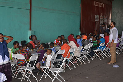 Children at one of the many tables being served 