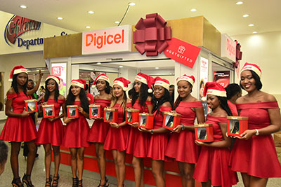 Digicel models display the various brands of handsets that are on sale at reduced prices for the Digicel Christmas Promotion at Giftland Mall on Thursday.