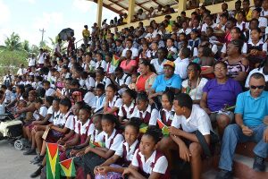 Students looking on during the bicycle distribution exercise in Kwakwani, Upper Demerara-Berbice (Region 10).