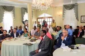 Minister of Business , Dominic Gaskin , in foreground , attended the opening segment of the seminar  on Thursday.