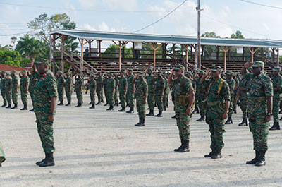 Soldiers saluting at the end of the GDF’s 51st Anniversary Route March on Saturday at D’Urban Park, Georgetown