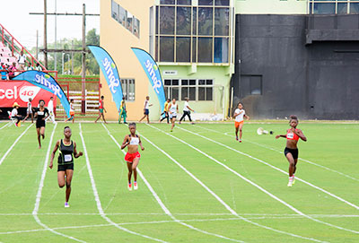 District 11’s Kenisha Phillips takes a comfortable win in the Girls’ Under -6 400m heats. 