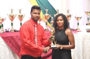 Rajkumar Budhram collects his MVP trophy.