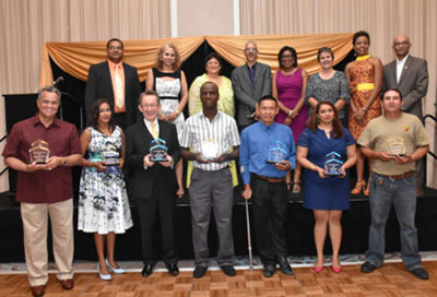 The awardees are in front row. Also in photograph are Minister of Business with responsibility for Tourism, Dominic Gaskin (fourth from left); Minister of Public Telecommunications, Catherine Hughes (fifth from left); President of THAG, Andrea de Caires (third from left); and Director of Guyana Tourism Authority, Indranauth Haralsingh