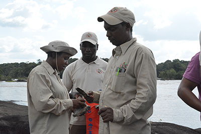 The geologists collect rock samples up the Mazaruni River 
