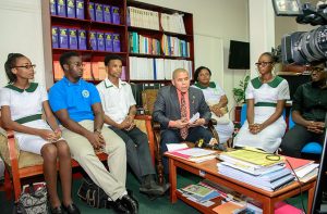 Minister of Public Health Dr. George Norton (centre) makes a point during a meeting with student nurses from across the country on Wednesday 