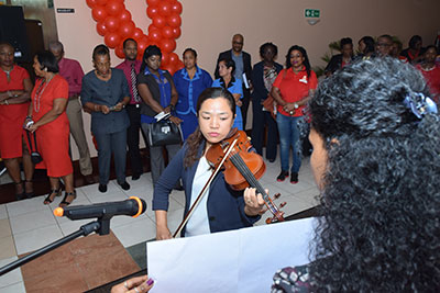 CARICOM Staffer, Ms. Chie Clarke thrills the hearts of the gathering at the World AIDS Day forum. 